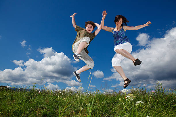 istock Mother and son jumping outdoor 140060529