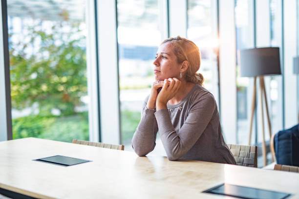 istock Pensive woman waiting for her order in a cafe 1400607741