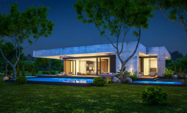 istock 3d rendering of new concrete house in modern style in night 1400607942