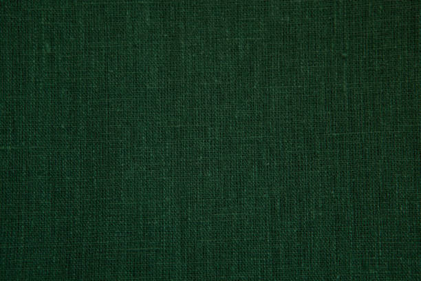 istock Textured background from natural linen fabric, green color. 1400610249
