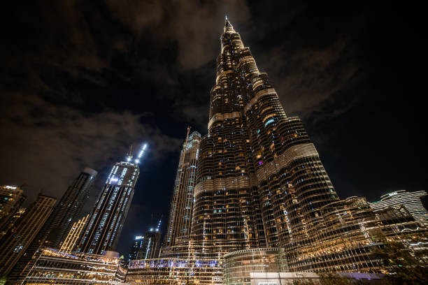 Dubai, UAE - November 09, 2021: Burj Khalifa in the night - is the tallest skyscraper in the world standing at 829.8m in Dubai, UAE Dubai, UAE - November 09, 2021: Burj Khalifa in the night - is the tallest skyscraper in the world standing at 829.8m in Dubai, UAE khalifa stock pictures, royalty-free photos & images