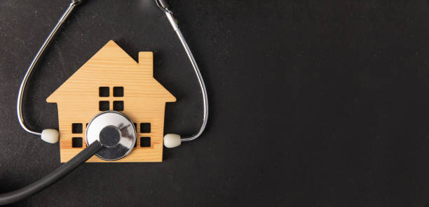 istock miniature house and stethoscope 1400610578