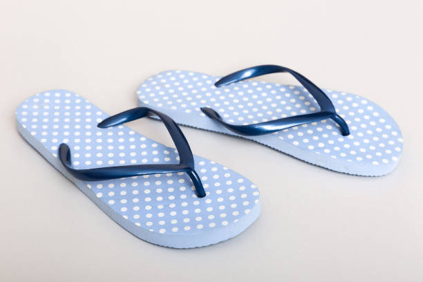 istock Beach accessories. Flip flops and starfish on colored background. Top view Mock up with copy space 1400611850