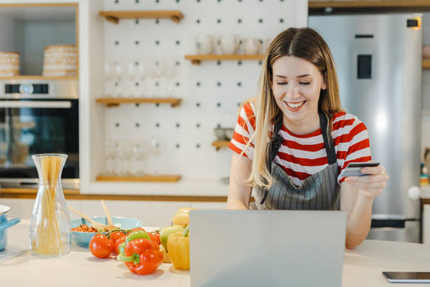istock Happy woman doing online grocery shopping 1400612189