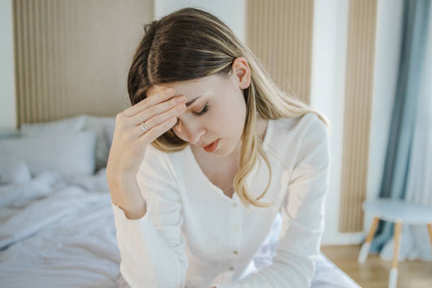 istock Young woman suffers from depression and headaches 1400613391