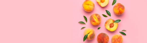 istock Summer fruit background. Flat lay composition with peaches. Ripe juicy peaches with green leaves on pink background. Flat lay top view copy space. Fresh organic fruit vegan food. Harvest concept 1400614700
