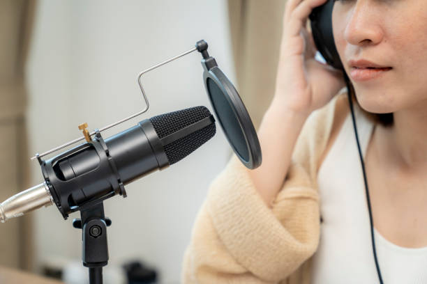 istock Female streaming audio podcast online at home 1400614795