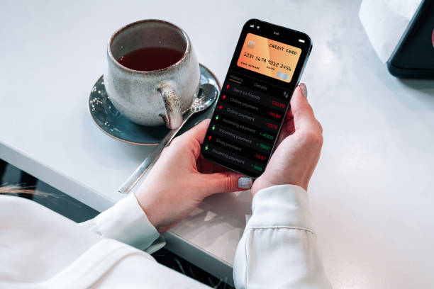 istock Mobile banking network. Smartphone with internet online bank application. Debit card wallet app. Save currency money wallet. 1400616915