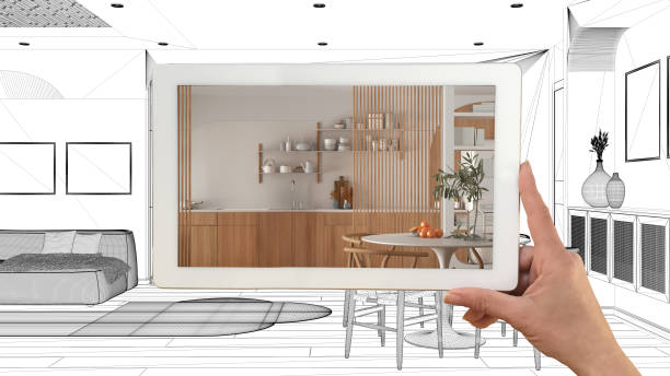 Augmented reality concept. Hand holding tablet with AR application used to simulate furniture products in custom architecture design, black ink sketch, living room and kitchen project