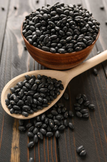 istock Fresh organic natural beans on wooden rustic black background 1400617289