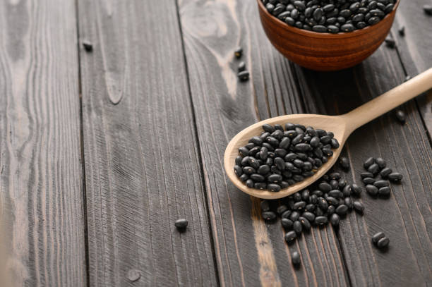istock Fresh organic natural beans on wooden rustic black background 1400617310