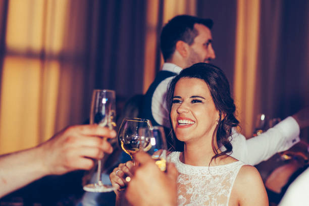 istock Happy young bride toasting with champagne 1400617520