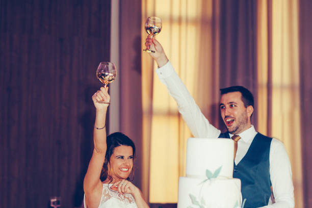 istock Happy bride and groom toasting with champagne 1400617523