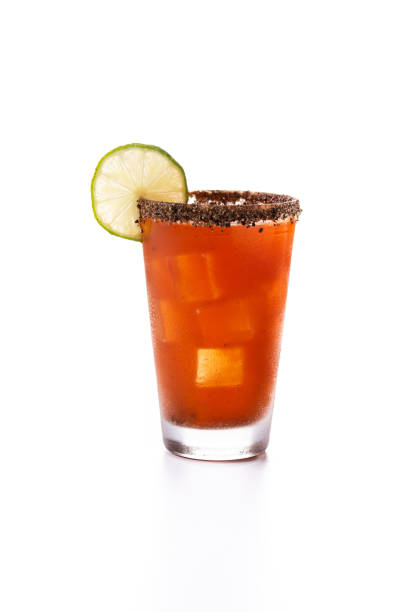 Homemade michelada cocktail with beer salted Rim and tomato juice stock photo