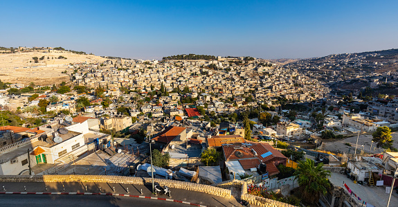 Jerusalem, Israel - October 12, 2017: Panorama of Mount of Olives with Siloam village over ancient City of David quarter seen from south wall of Temple Mount in Jerusalem Old City
