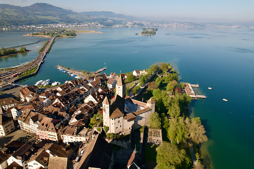 Aerial view of the old town of City of Rapperswil-Jona with border of Lake Zürich on a sunny spring day. Photo taken April 28th, 2022, Rapperswil-Jona, Canton St. Gallen, Switzerland.