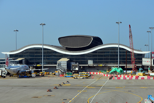 Hong Kong, China: Hong Kong International Airport - the North Satellite Concourse offers 10 aircraft stands specifically for narrow bodied planes serving the short haul market - HKIA, Chek Lap Kok island.