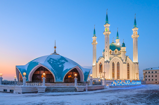 The Kul Sharif Mosque and the Kazan Kremlin buildings at sunset on a winter day. The Kazan Kremlin is an ancient part of the city of Kazan, surrounded by fortress walls