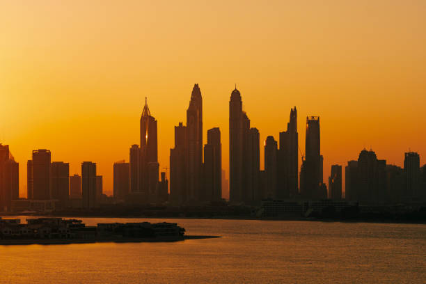 Cityscape with evening sunset and amazing skyscrapers in Dubai Sunset and city skyline in Dubai arabian peninsula stock pictures, royalty-free photos & images