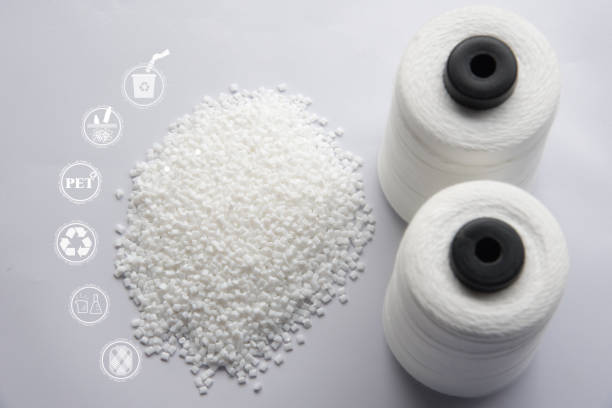 White Pet Chips Semi Dull,PET chips recycle,PET polyester chips and Raw White Polyester FDY Yarn spool with white background. Recycle icon, sustainable icon and Bottle icon.Chemical concept. White Pet Chips Semi Dull,PET chips recycle,PET polyester chips and Raw White Polyester FDY Yarn spool with white background. Recycle icon, sustainable icon and Bottle icon.Chemical concept. 3d printing filament photos stock pictures, royalty-free photos & images