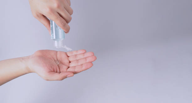 istock Hands is squeezeing alcohol hand gel on white background. 1400633310