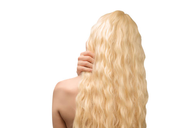 Woman with long blond and curly hair.  Woman back isolated.