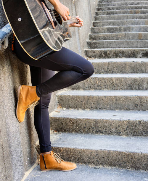 Close-up of stylish black platform boots with chains and buckles, showcasing urban fashion