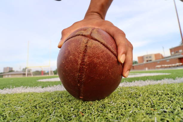 istock Catching the football 1400635425