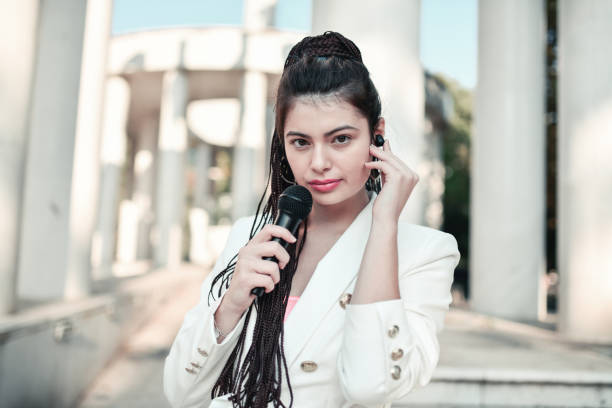 istock Modern Female Journalist Waiting For Sign To Start Reporting Event From Downtown 1400637145