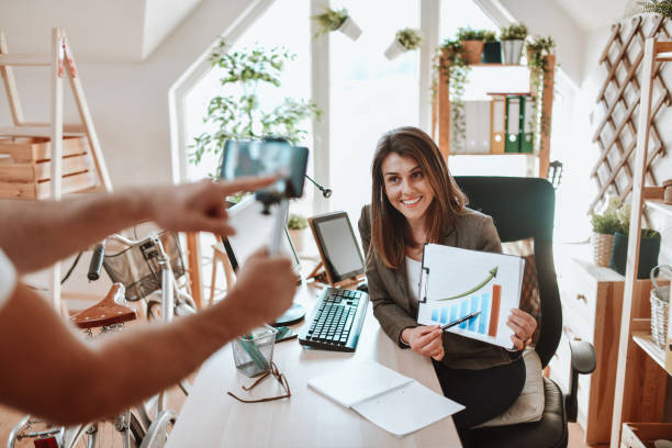 istock Smiling Female Explaining Graphic Charts During Video Lesson 1400638489
