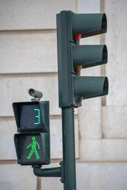 green traffic light for pedestrians counting down in 3 seconds in Lisbon. stock photo