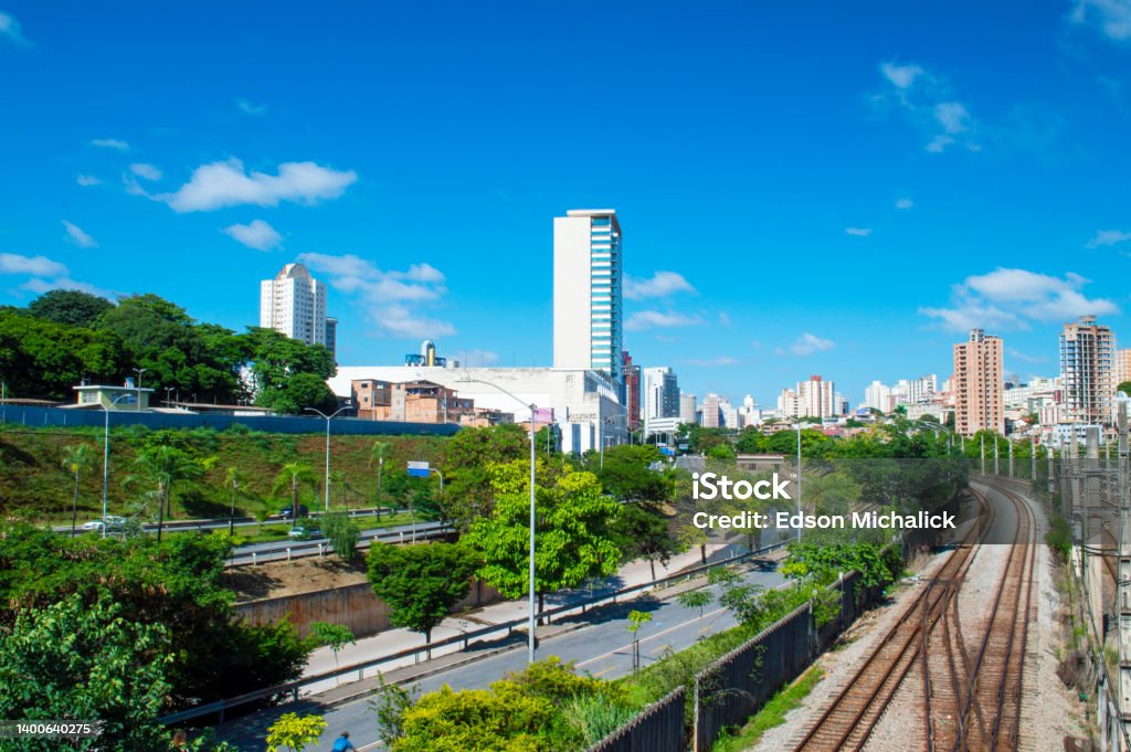 Residential panorama with buildings, trees, blue sky, railway, clouds in the city of Belo Horizonte. Belo Horizonte Stock Photo