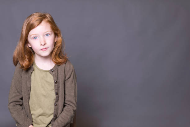 istock Auburn-haired girl day dreaming 1400641060