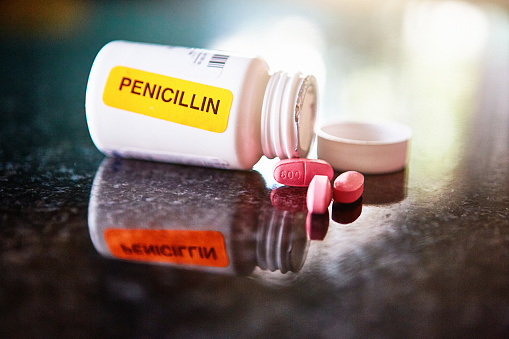 Pharmacist has stuck a bright orange sticker on a container of antibiotics to draw attention to the fact that they contain penicillin, to which some people are allergic.