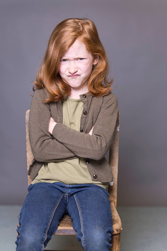 Pretty 7-year-old Caucasian girl with ginger hair and blue eyes.