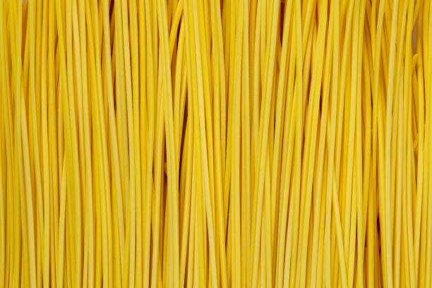 istock Macro Spaghetti,Unprepared spaghetti dry. Macro background. High quality photo 1400644303