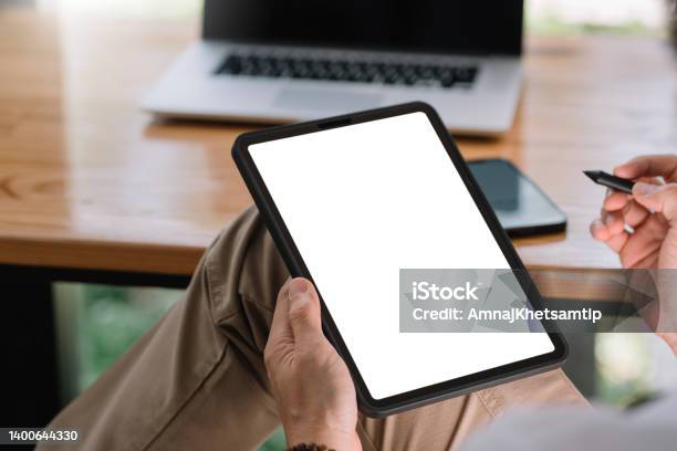 Close Up View Of Man Using Tablet Blank White Screen For Text Message Or Information Stock Photo - Download Image Now