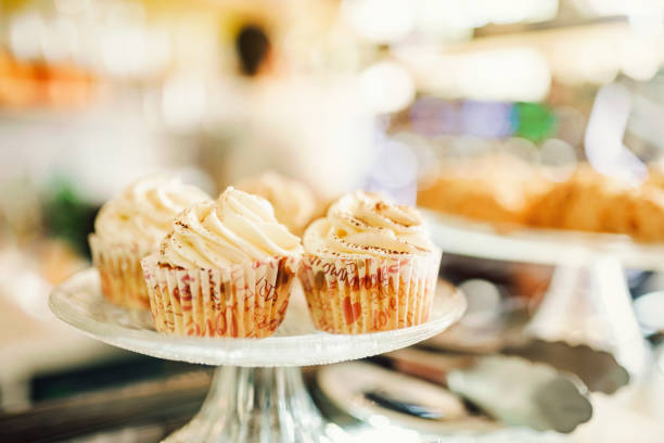 Sweet vanilla cupcake with buttercream in a cafe. Sweet food