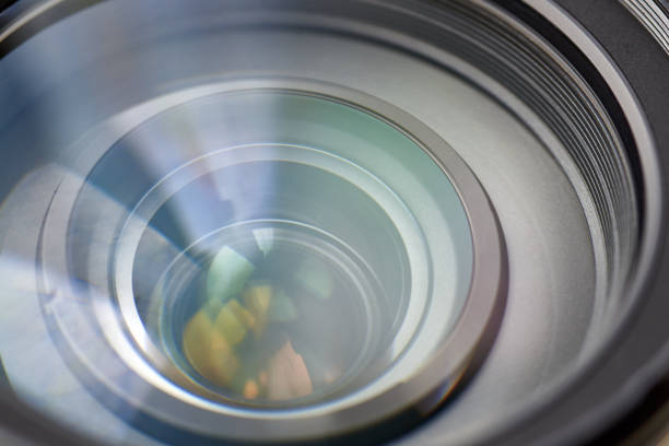 Camera lens with reflection, macro photo, close-up, backdrop.