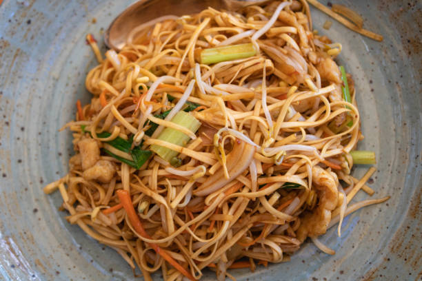 istock Chinese chicken noodles served on a plate, top view 1400646803