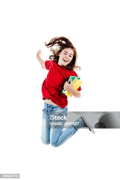 Foto de Menina Pulando Isolado No Fundo Branco e mais fotos de stock de Livro - Livro, Pular, Adolescentes Meninas