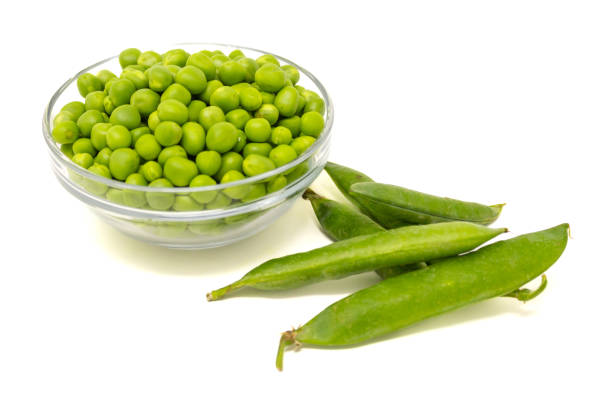 istock Bowl of peas and pods, view from above, white background 1400648002