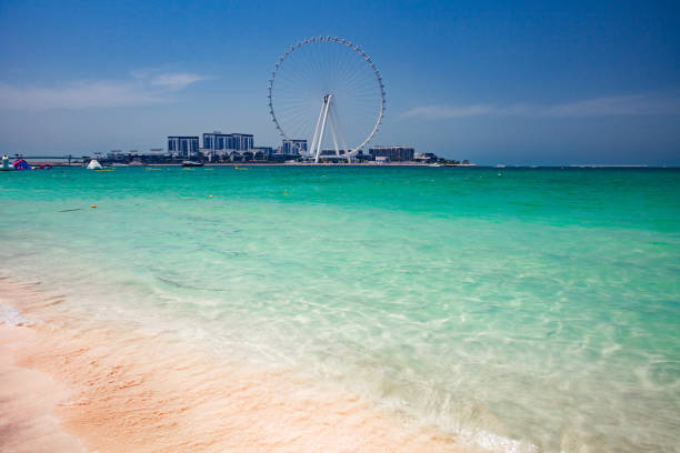 Dubai, UAE - April 21, 2022: Ain Dubai Ferris Wheel, sand on the beach, day view.