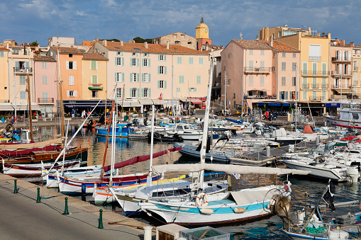 Boats arrives into Saint Tropez Harbor, one of the most famous places in the world located on French Riviera, Cote d'Azur, Mediterranean Sea, Saint Tropez was made famous by Brigitte Bardot in the 1960s, it is a playground for actors, models, millionaires and jetsetters.