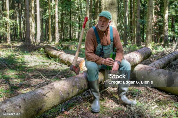 Work Break In The Forest Stock Photo - Download Image Now - Lumberjack, Senior Adult, Rubber Boot