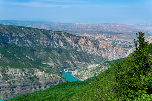 mountain landscape in the Caucasus with a view of the valley of the Sulak River, the Miatli hydroelectric power station and the towns of New Zubutli and Kizilyurt in the distance\