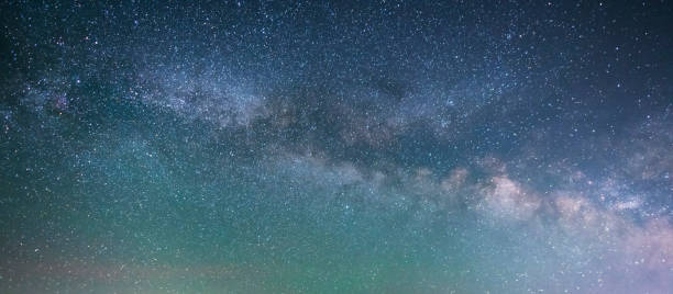 istock Beautiful bright milky way galaxy at the night sky. Astronomical background. 1400650696