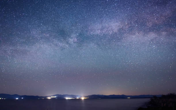 istock Beautiful bright milky way galaxy at the night sky 1400650700