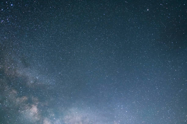 istock Beautiful bright milky way galaxy at the night sky. Astronomical background. 1400650751