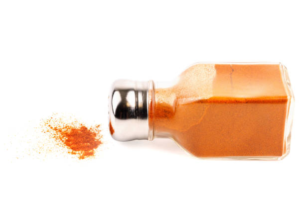 istock glass pepper pot with ground red pepper dropped on its side isolated on white background 1400651347